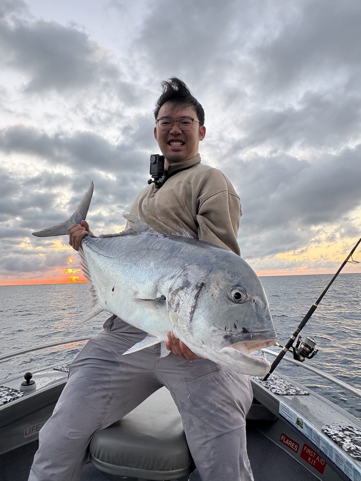 A giant trevally at sunset