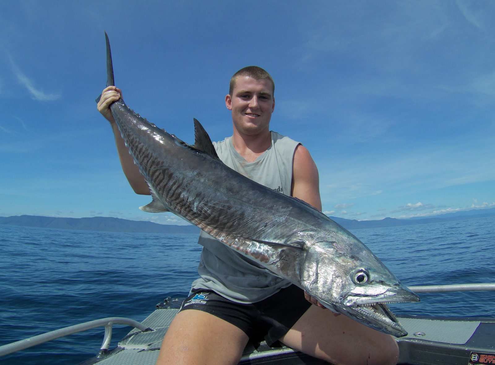 A spanish mackerel held up
